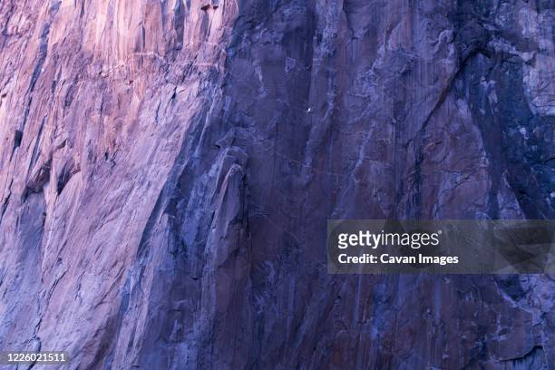 face view of el capitan at sunset with climbers on the big wall - bedrock fotografías e imágenes de stock