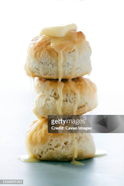 stack of buttermilk biscuits with butter dripping - buttermilk biscuit stock pictures, royalty-free photos & images