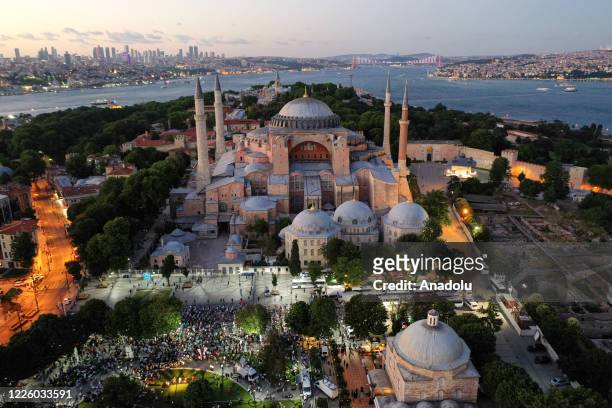 Drone photo shows people performing the evening prayer at Ayasofya Square after the 10th Chamber of the Council of State's decision of the annulment...