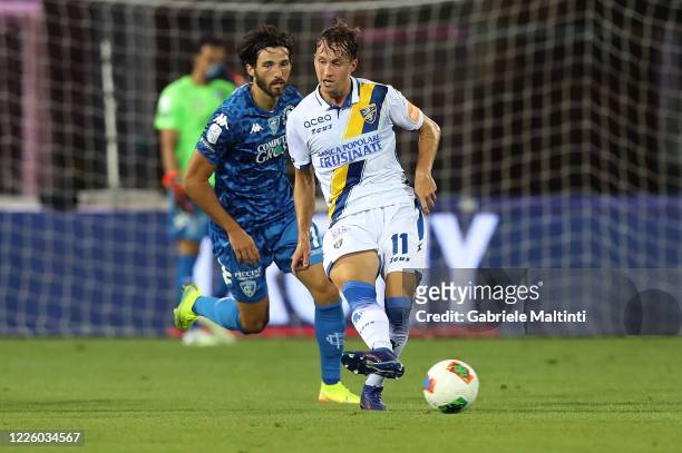 Leonardo Mancuso of Empoli FC battles for the ball with Nicolas Haas of Frosinone Calcio during the Serie B match between FC Empoli v Frosinone...