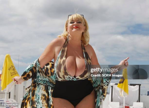 Mila seen posing during the event. National Register of Records of Ukraine registered Ukrainian model, Mila Kuznetsova with the largest natural...