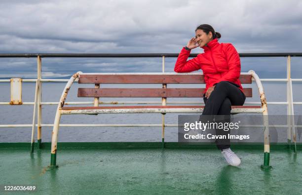 woman relaxing on a passenger vessel traveling in south america - puerto montt stock pictures, royalty-free photos & images