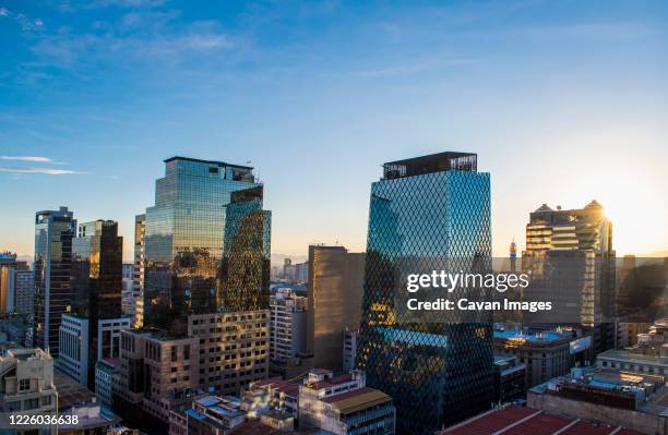 financial district of santiago de chile in the evening - santiago chile skyline stock pictures, royalty-free photos & images