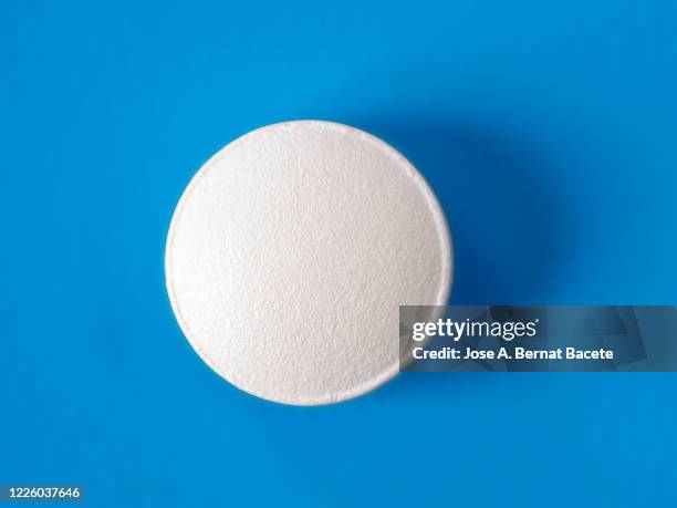 medicine pill on a blue background. - tablet pill stock pictures, royalty-free photos & images