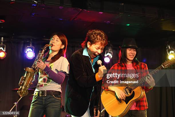 young people playing instruments on the stage - players association stock pictures, royalty-free photos & images