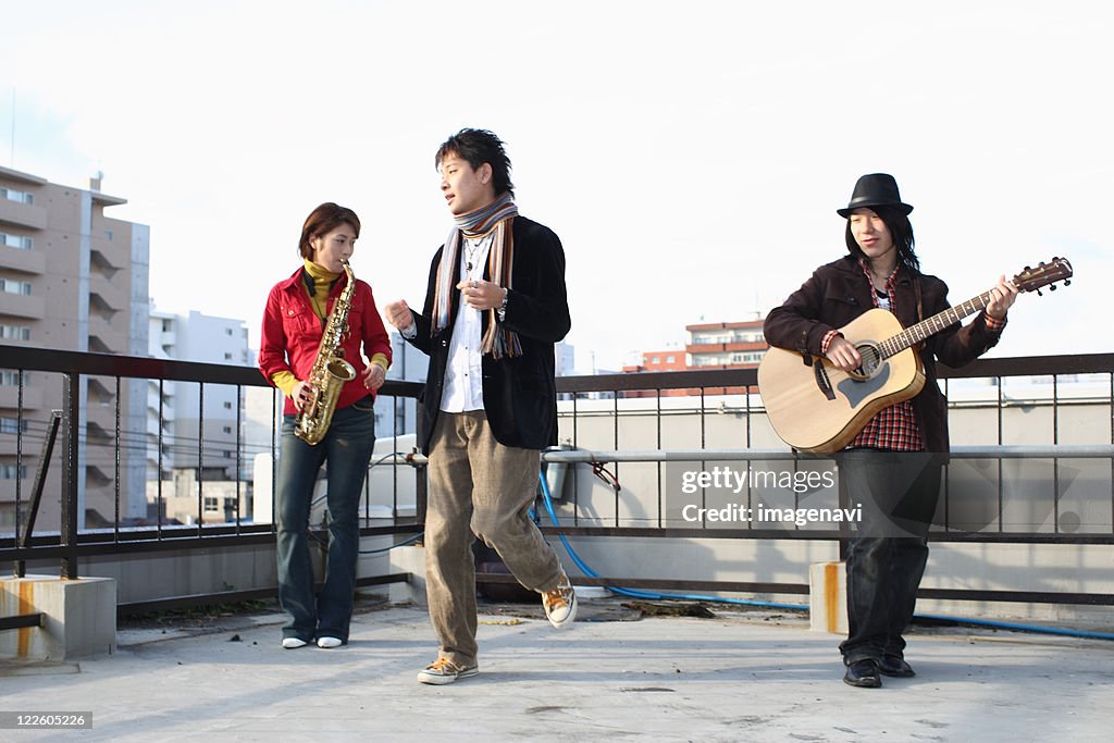 Young people playing instruments