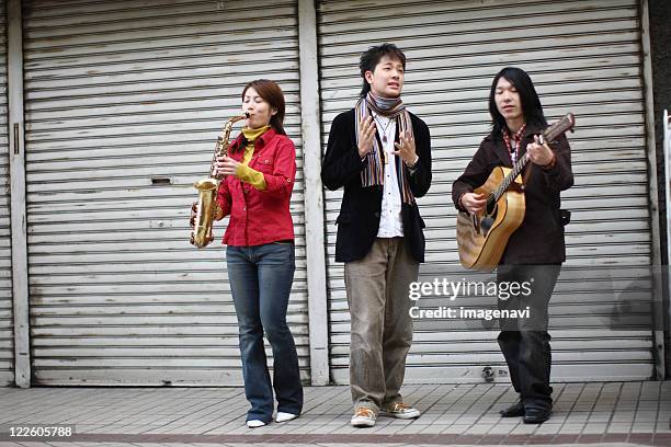 street musicians - street musician stock pictures, royalty-free photos & images