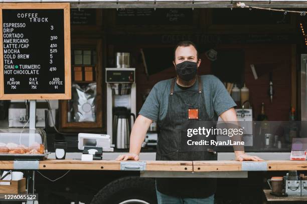 food truck owner wearing protective face mask - seattle coffee stock pictures, royalty-free photos & images