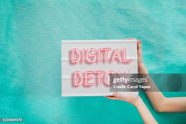 hand holding digital detox banner - digital detox stock pictures, royalty-free photos & images