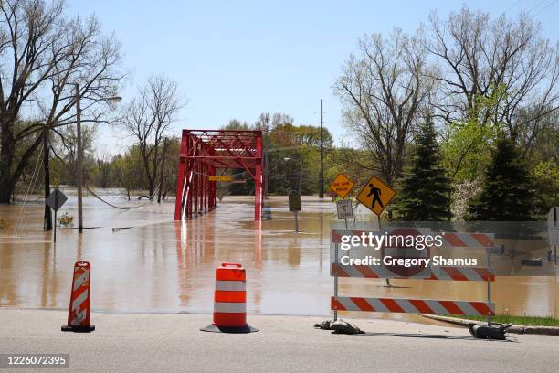 View of floodwaters flowing from the Tittabawassee River into the lower part of downtown Midland on May 20, 2020 in Midland, Michigan. Thousands of...