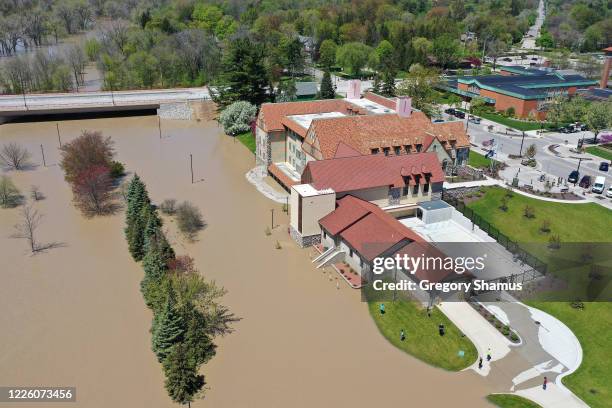 Aerial view of floodwaters flowing from the Tittabawassee River into the lower part of downtown Midland on May 20, 2020 in Midland, Michigan....