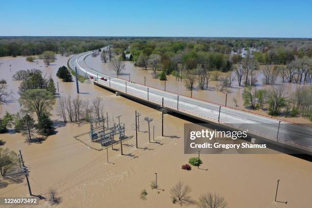 Aerial view of floodwaters flowing from the Tittabawassee River into the lower part of downtown Midland on May 20, 2020 in Midland, Michigan....