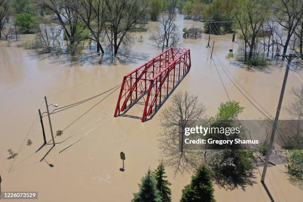 Aerial view of floodwaters flowing from the Tittabawassee River into the lower part of downtown Midland on May 20, 2020 in Midland, Michigan....