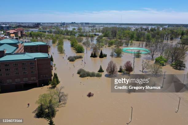 Aerial view of floodwaters flowing from the Tittabawassee River into the lower part of downtown Midland on May 20, 2020 in Midland, Michigan....