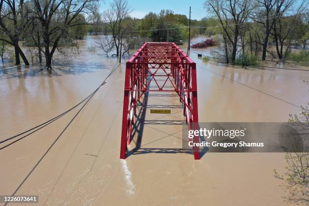 Aerial view of floodwaters flowing from the Tittabawassee River into the lower part of downtown Midland on May 20, 2020 in Midland, Michigan....