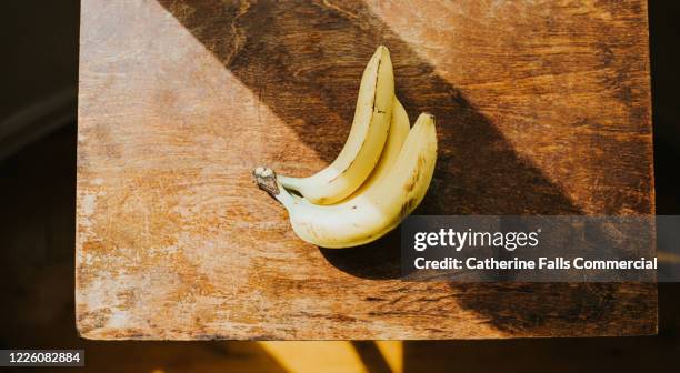 Bunch of Raw Organic Bananas Ready to Eat Stock Photo by esindeniz