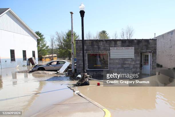 Main street is flooded after water from the Tittabawassee River breached a nearby dam on May 20, 2020 in Sanford, Michigan. Thousands of residents...