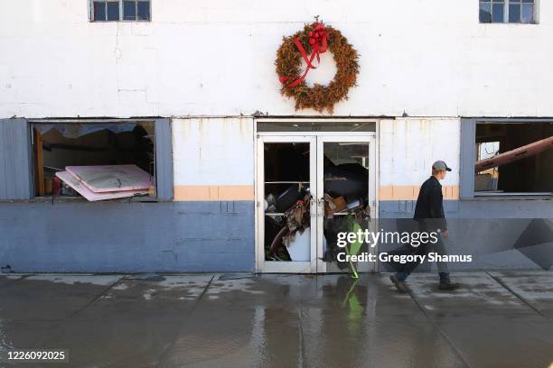 Damage on main street after water from the Tittabawassee River breached a nearby dam on May 20, 2020 in Sanford, Michigan. Thousands of residents...