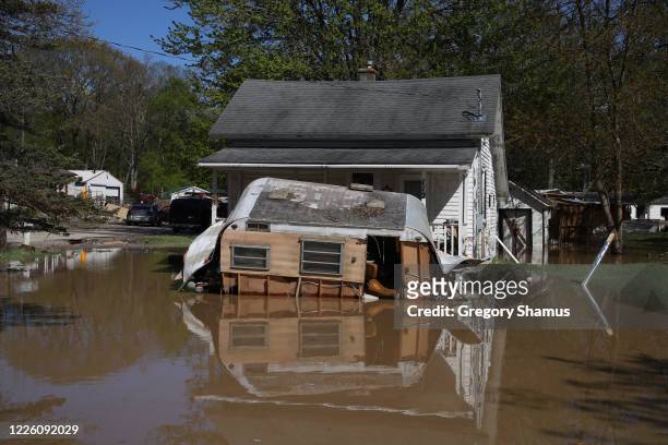Homes flooded after water from the Tittabawassee River breached a nearby dam on May 20, 2020 in Sanford, Michigan. Thousands of residents have been...