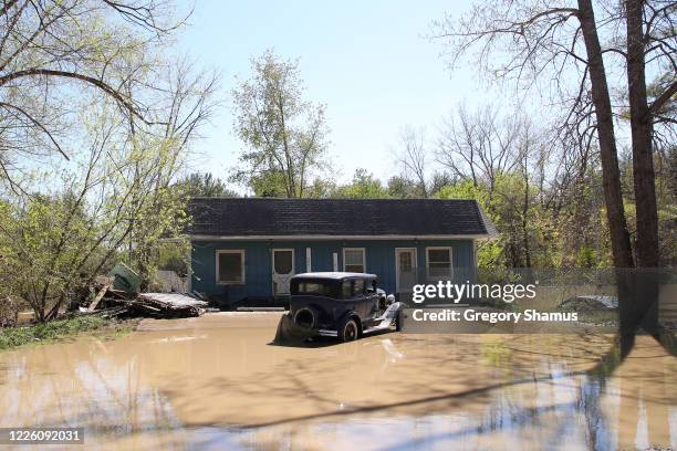 Homes flooded after water from the Tittabawassee River breached a nearby dam on May 20, 2020 in Sanford, Michigan. Thousands of residents have been...