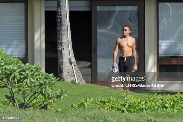 Shirtless Barack Obama is seen as he vacations with his family at a beachside compound on December 21, 2008 in Kailua, Hawaii.