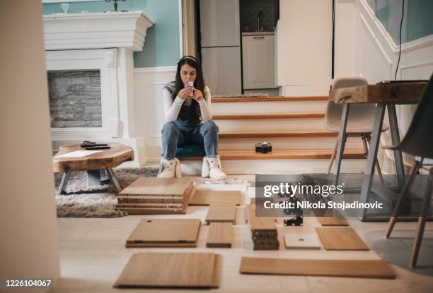 women using phone at hom - model kit stock pictures, royalty-free photos & images