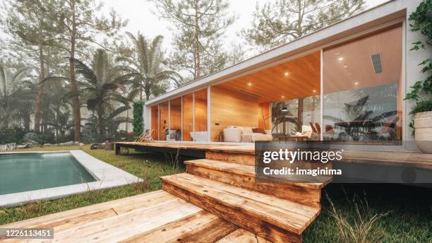 modern house in the forest - cottage window stock pictures, royalty-free photos & images