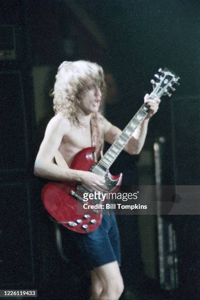 July 1983]: MANDATORY CREDIT Bill Tompkins/Getty Images on Angus Young lead guitarist of AC/DC performs at Madison Square Garden July 1983 in New...