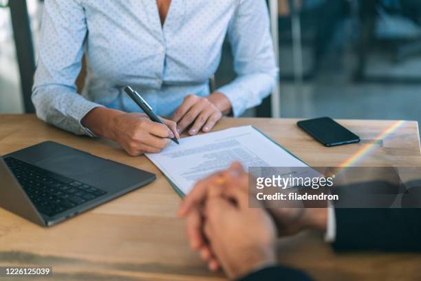 signing contract - insurance stock pictures, royalty-free photos & images