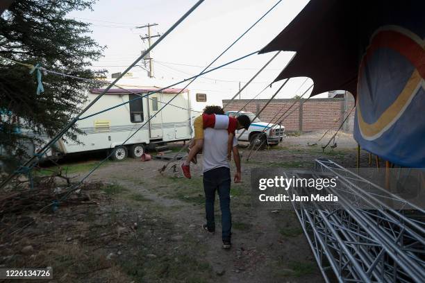 Jose Ponce and his children train circus activities on May 20, 2020 in Queretaro, Mexico. As nonessential activities are not permitted during stage...