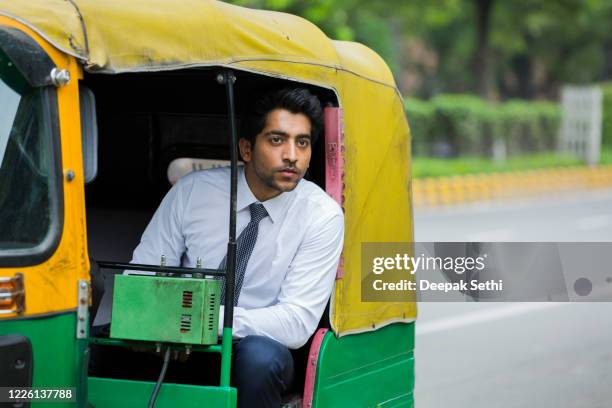 young businessman on the city. stock photo - indian ethnicity man car stock pictures, royalty-free photos & images