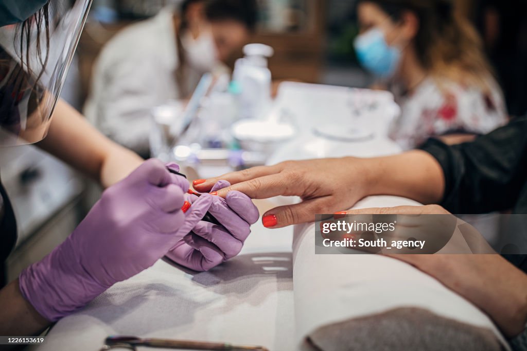 Close up of manicure treatment in beauty salon