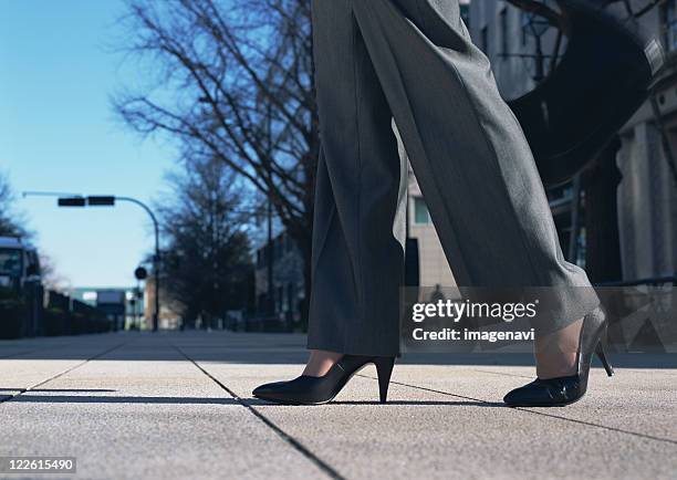 image of woman's feet - pant suit stock pictures, royalty-free photos & images