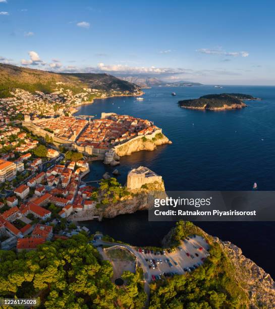 sunset scene aerial drone view at famous european travel destination dubrovnik old town in croatia, top view from drone at on the old castle and iconic croatian house roof - dubrovnik old town stock pictures, royalty-free photos & images