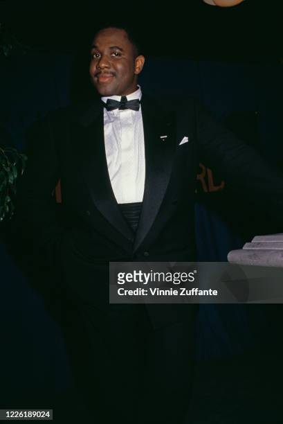 American singer Freddie Jackson wearing a dinner jacket and bow tie at an event, circa 1990.