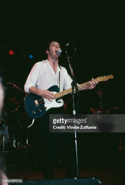American singer-songwriter Steve Forbert playing the guitar during a concert performance, circa 1990.