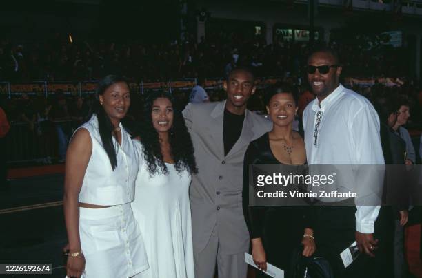 American basketball player Kobe Bryant and his sisters, Shaya Bryant and Sharia Bryant, attend an event in Los Angeles, California, 1996.