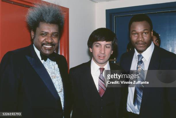 American boxing promoter Don King, American sports commentator Marv Albert, and American heavyweight boxer Larry Holmes, circa 1983.