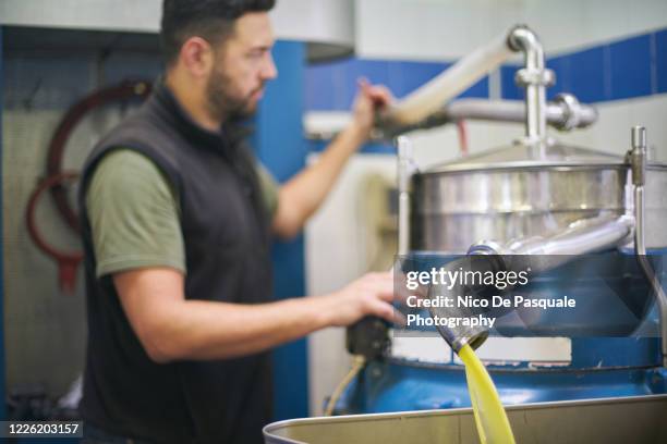 extra virgin olive oil production - oliva foto e immagini stock