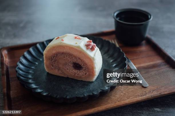 strawberry sponge cake served in plate on the table - japanese flower arrangement stock pictures, royalty-free photos & images