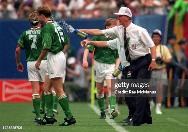 United States - 18 June 1994; Republic of Ireland manager Jack Charlton splashes water on Tommy Coyne and Andy Townsend during the FIFA World Cup...