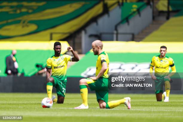 Norwich City's Ghanaian-born Norwegian midfielder Alexander Tettey takes a knee to show support for the Black Lives Matter movement and protest...