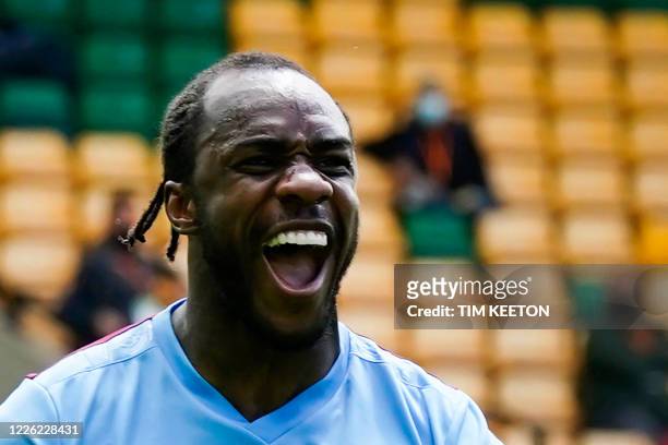 West Ham United's English midfielder Michail Antonio celebrates after scoring a goal during the English Premier League football match between Norwich...