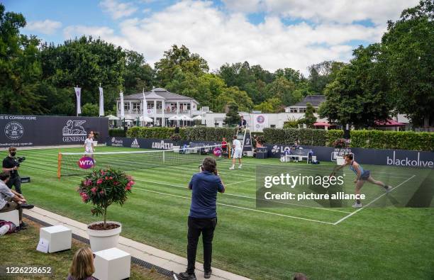 July 2020, Hessen, Bad Homburg: In a show-mixed for the opening of the Bad Homburg Center Court, young player Mara Guth , Davis Cup team boss Michael...