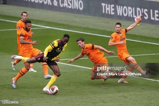 Jamaal Lascelles of Newcastle , Fabian Schar of Newcastle and Federico Fernandez of Newcastle try to block a shot from Danny Welbeck of Watford...