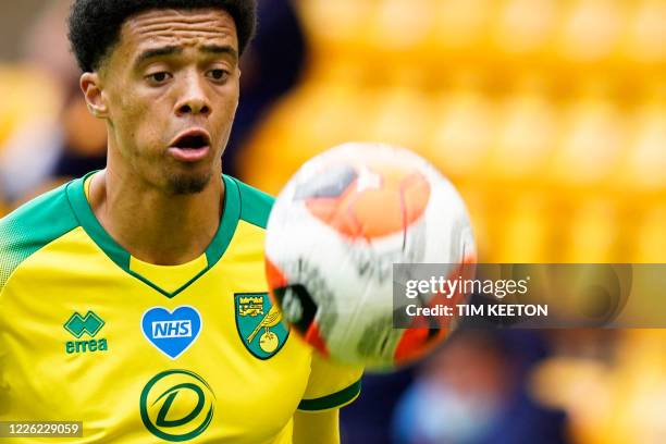 Norwich City's English-born Northern Irish defender Jamal Lewis eyes the ball during the English Premier League football match between Norwich City...