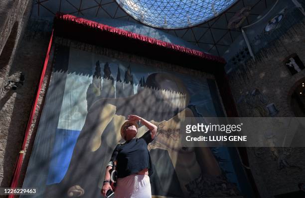 People visit the Salvador Dali museum in Figueras, as it reopened again to the public, on July 11 after being closed for more than three months due...