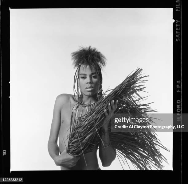RuPaul Andre Charles holding grass skirt in his hands. Shot waist up, on location at Edgewood Studio in Atlanta, Georgia as part of the Club Kids...