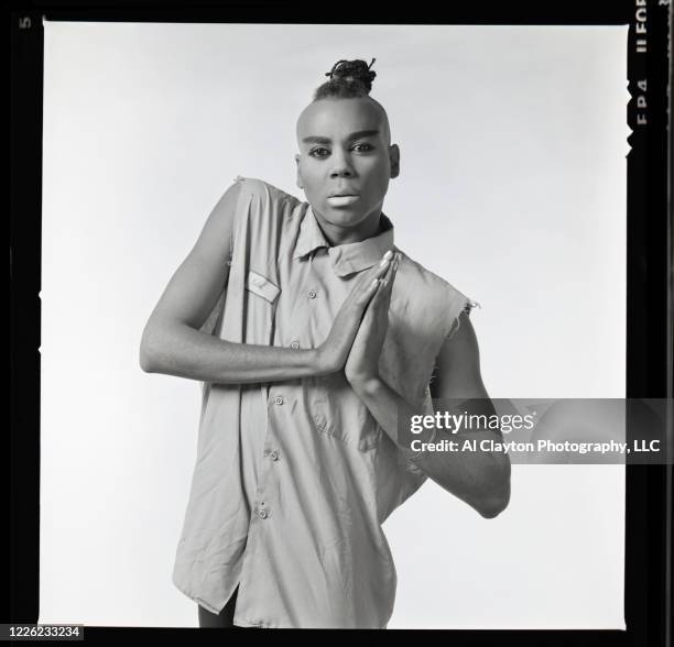 RuPaul Andre Charles wearing a blue collar shirt and holding hands together over his chest. Shot waist up, on location at Edgewood Studio in Atlanta,...