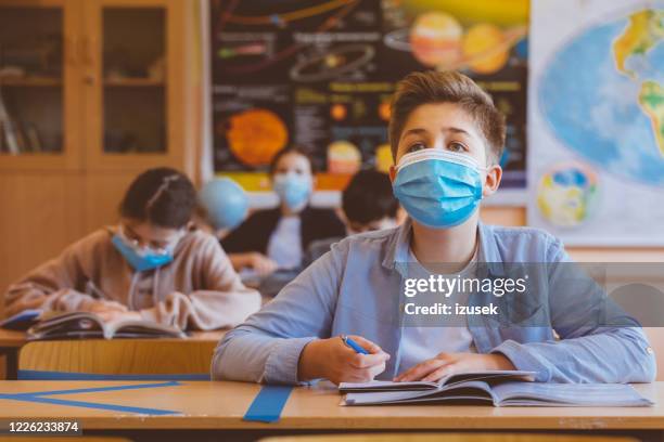 high school boy student at school wearing n95 face masks - secondary school covid stock pictures, royalty-free photos & images